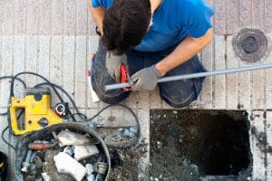 A man is working on a property hole.